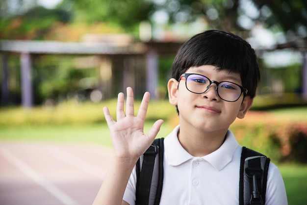 Young Asian Thailand boy happy going to school