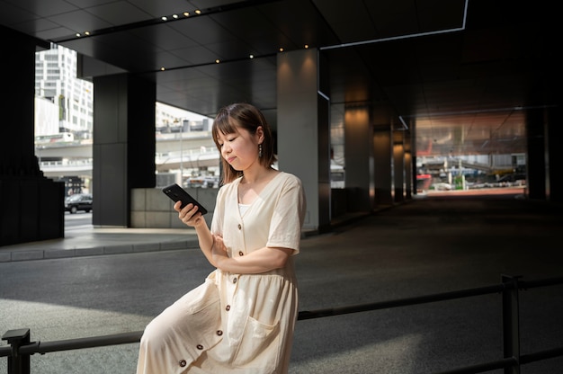 Young asian woman checking her phone