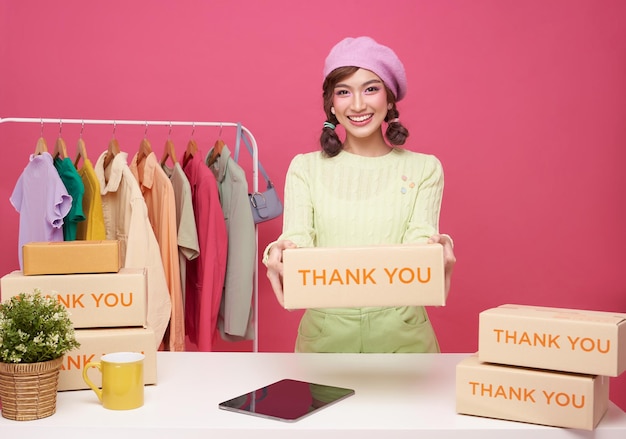 Young asian woman startup small business freelance seller clothing with parcel box and tablet