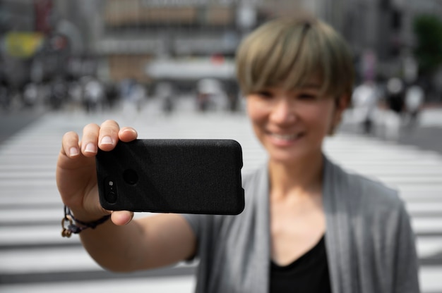 Young asian woman taking a selfie