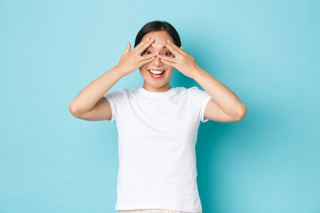 Young Asian woman wearing casual T-shirt posing