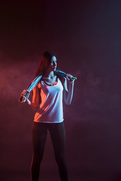 Free photo young athlete woman with towel