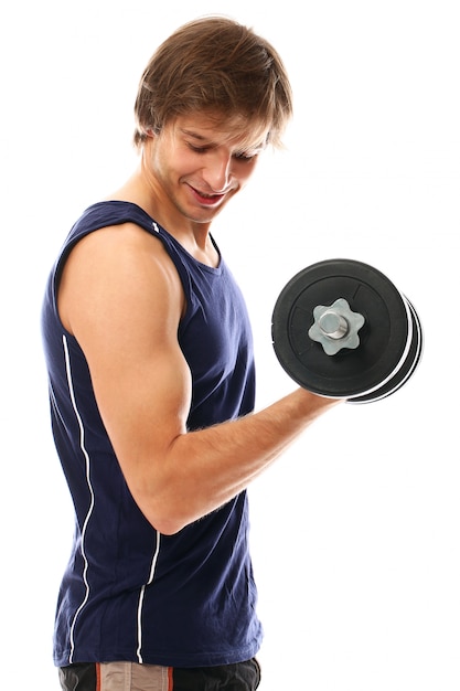 Young athletic man with sportswear holding dumbbells