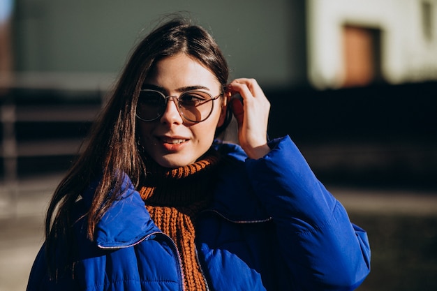 Young attractive woman in blue winter jacket