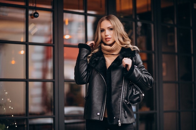 Young attractive woman dressed casual by the cafe