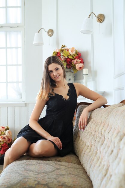 Young attractive woman posing in sofa