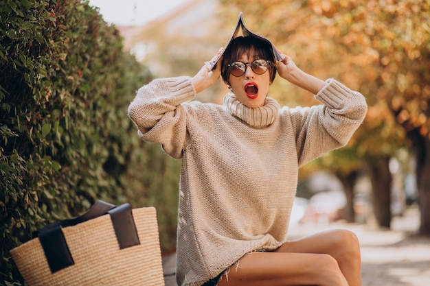 Young attractive woman reading magazine