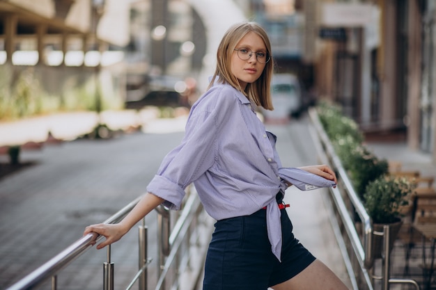 Young attractive woman walking in the street