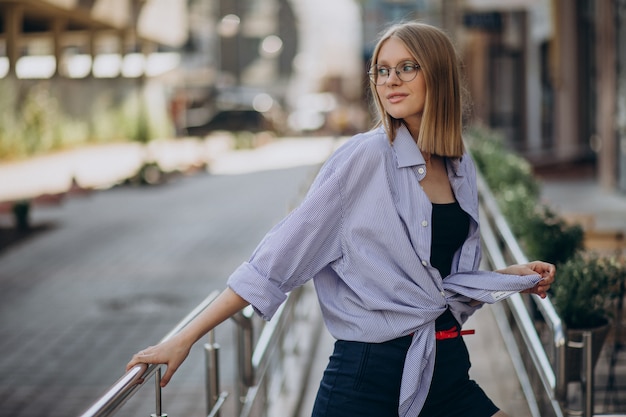 Young attractive woman walking in the street