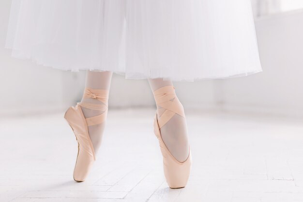 Young ballerina, closeup on legs and shoes