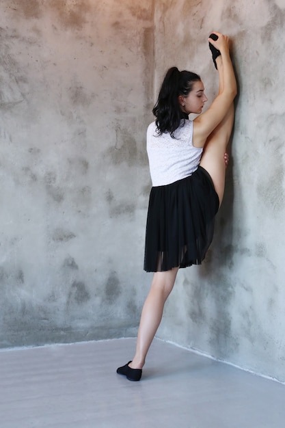 Free photo young ballerina stretching