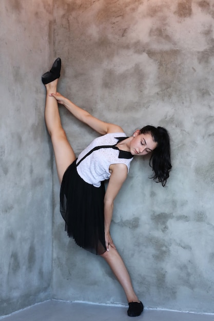 Young ballerina stretching