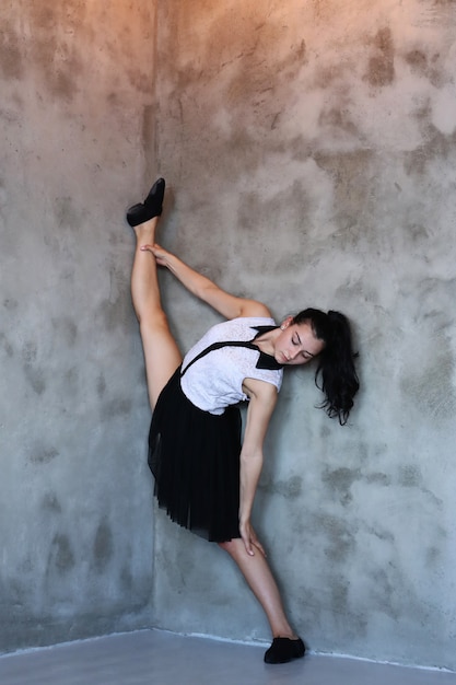 Free photo young ballerina stretching