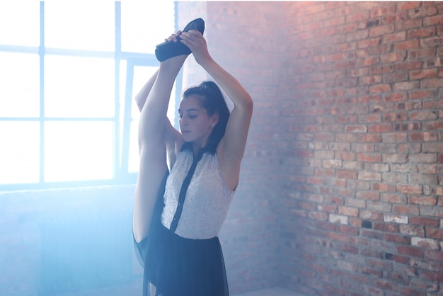 Young ballerina stretching