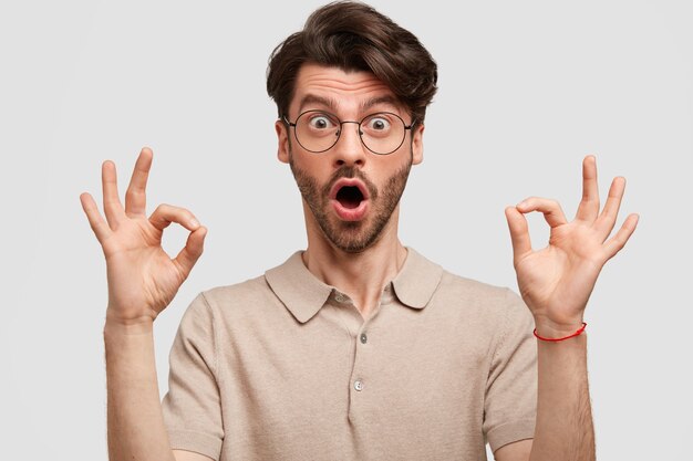 Young bearded man with round glasses