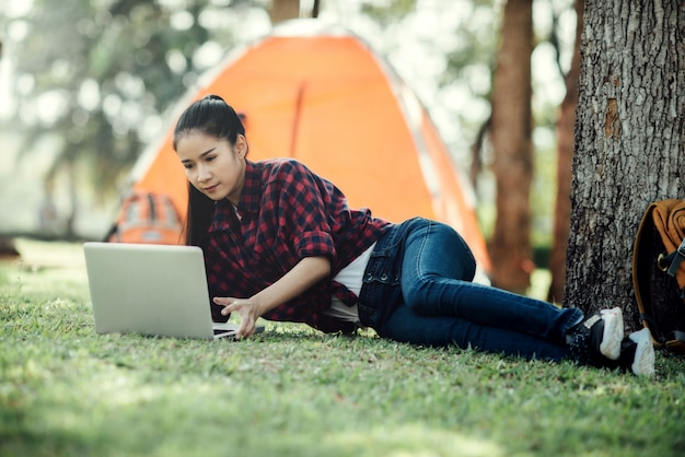 Free Photo young beautiful asian girl using laptop.