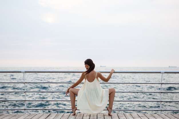 Free photo young beautiful ballerina dancing and posing outside