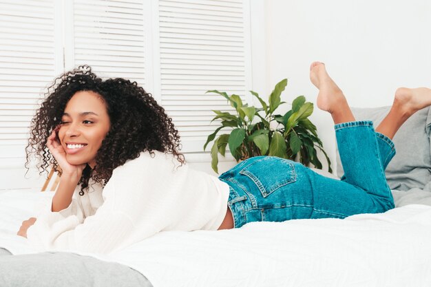 Young beautiful black female with afro curls hairstyle