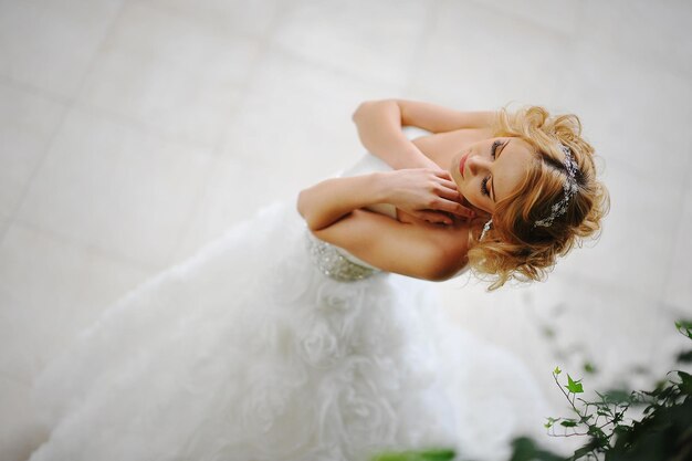 Young beautiful blonde model bride