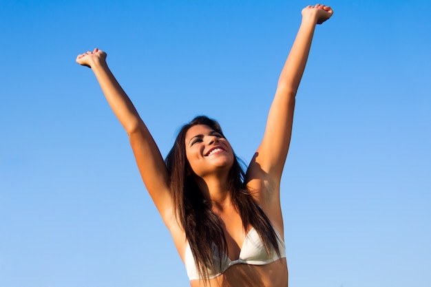 Young beautiful brunette woman having fun at the park