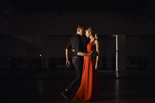 Young beautiful couple dancing with passion