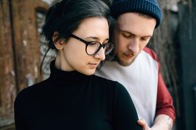 Young beautiful couple posing over an old building