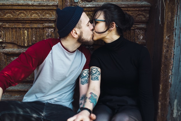 Young beautiful couple posing over an old building