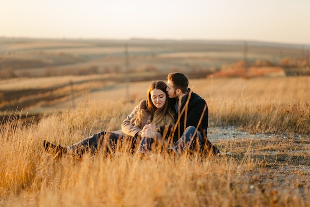 Young and beautiful  couple walking outdoors on a sunny day