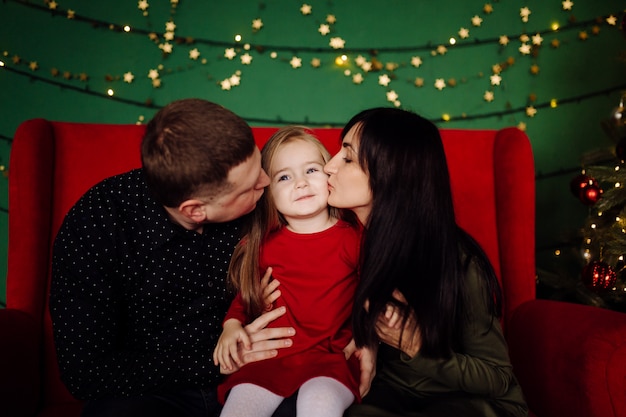 Young beautiful father and mother with baby