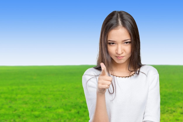 Young beautiful happy caucasian woman pointing on you