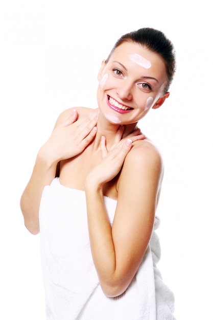 Young and beautiful happy woman relaxing in spa