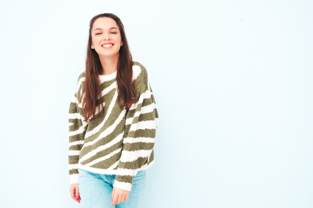 Young beautiful smiling female in trendy summer hipster clothes