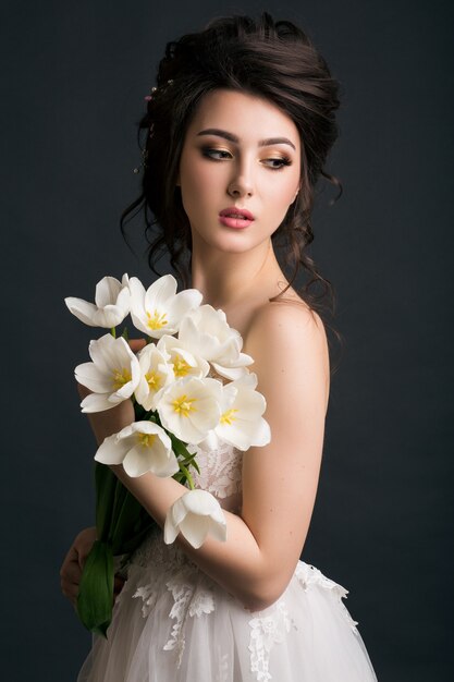 Young beautiful stylish woman in wedding dress