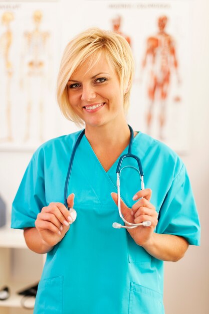 Young and beautiful surgeon posing at her office