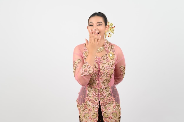 Young beautiful woman dress up in local culture southern region closed her mouth posture