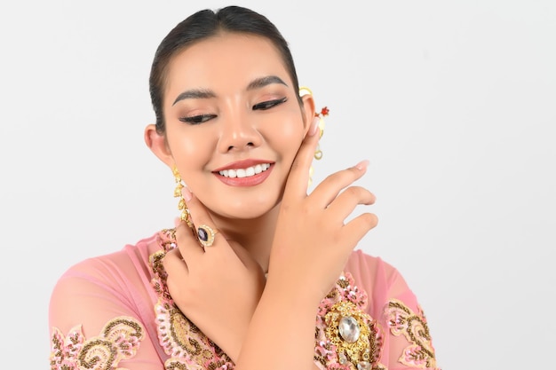 Young beautiful woman dress up in local culture in southern region with beauty posture