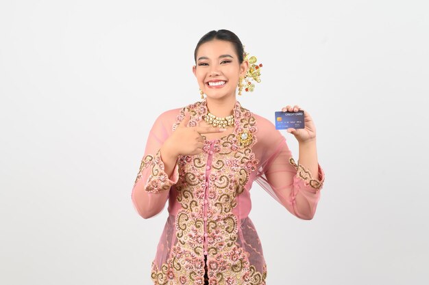 Young beautiful woman dress up in local culture in southern region with credit card