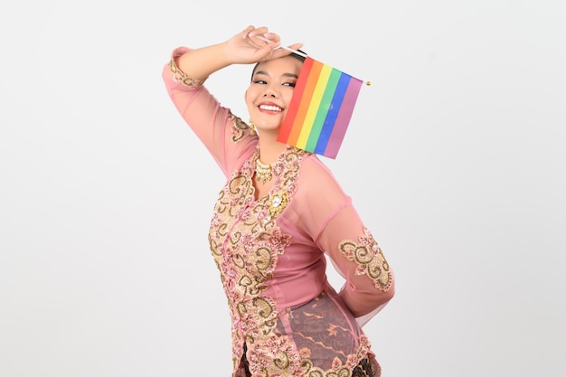 Young beautiful woman dress up in local culture in southern region with rainbow flag