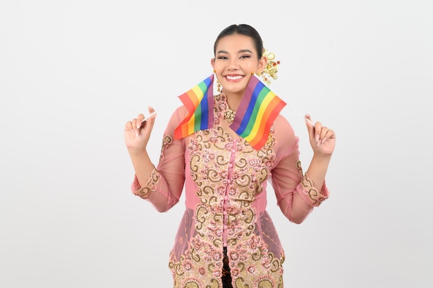 Young beautiful woman dress up in local culture in southern region with rainbow flag