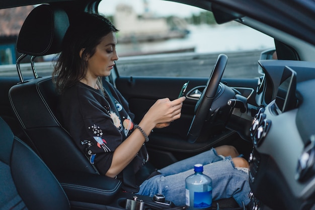 young beautiful woman driving car. portrait close-up