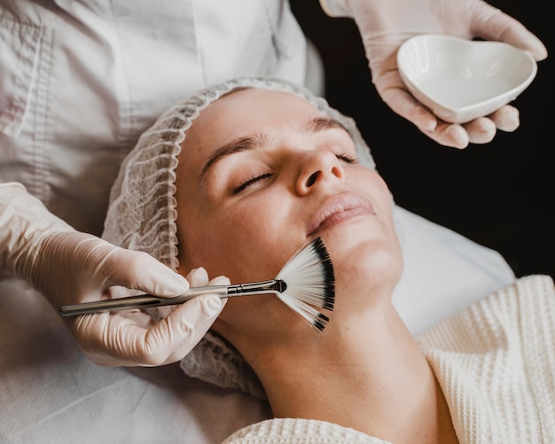 Free Photo young beautiful woman getting a face skin treatment at the spa