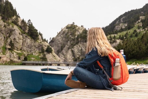 Young beautiful woman traveling in the mountains