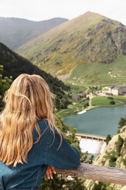 Young beautiful woman traveling in the mountains