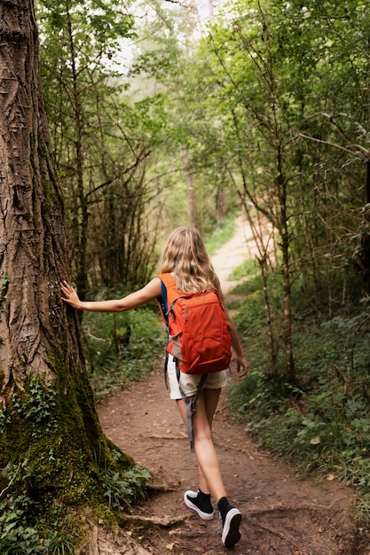 Young beautiful woman traveling in the mountains