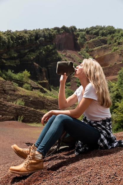 Young beautiful woman traveling in the mountains