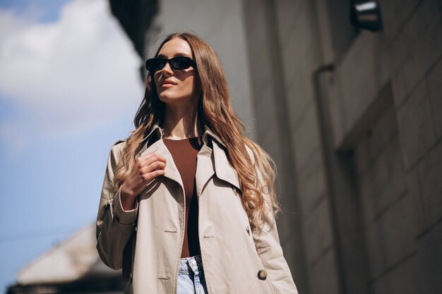 Young beautiful woman walking in the city