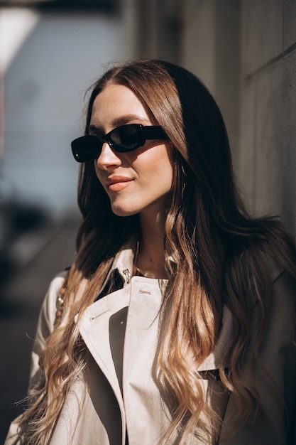 Young beautiful woman walking in the city