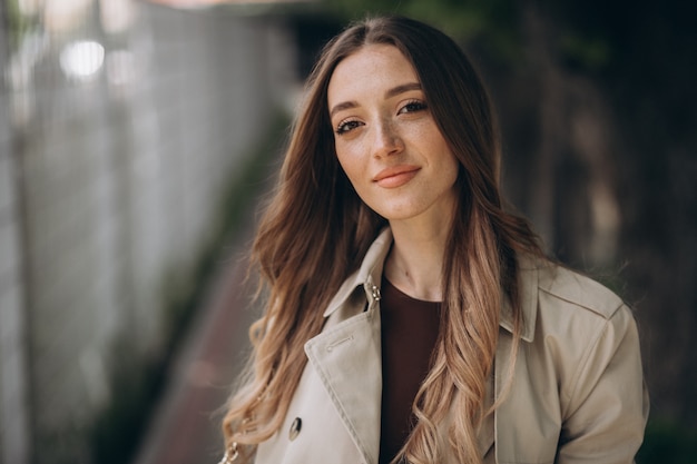 Young beautiful woman walking in a park