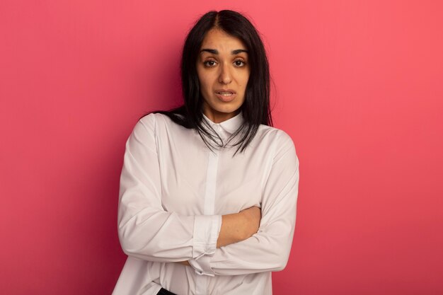 Young beautiful woman wearing white t-shirt crossing hands