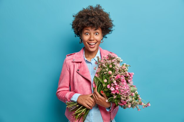 Young beautiful woman with curly hair isolated